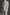 Beige suit with a striped tie on a dark background