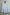 Light blue smart shirt on a wooden hanger against a light background