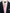 Navy suit jacket with a pink smart shirt and tie on a light background