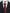 Navy suit jacket with a white shirt and red tie, Wildcard brand visible.